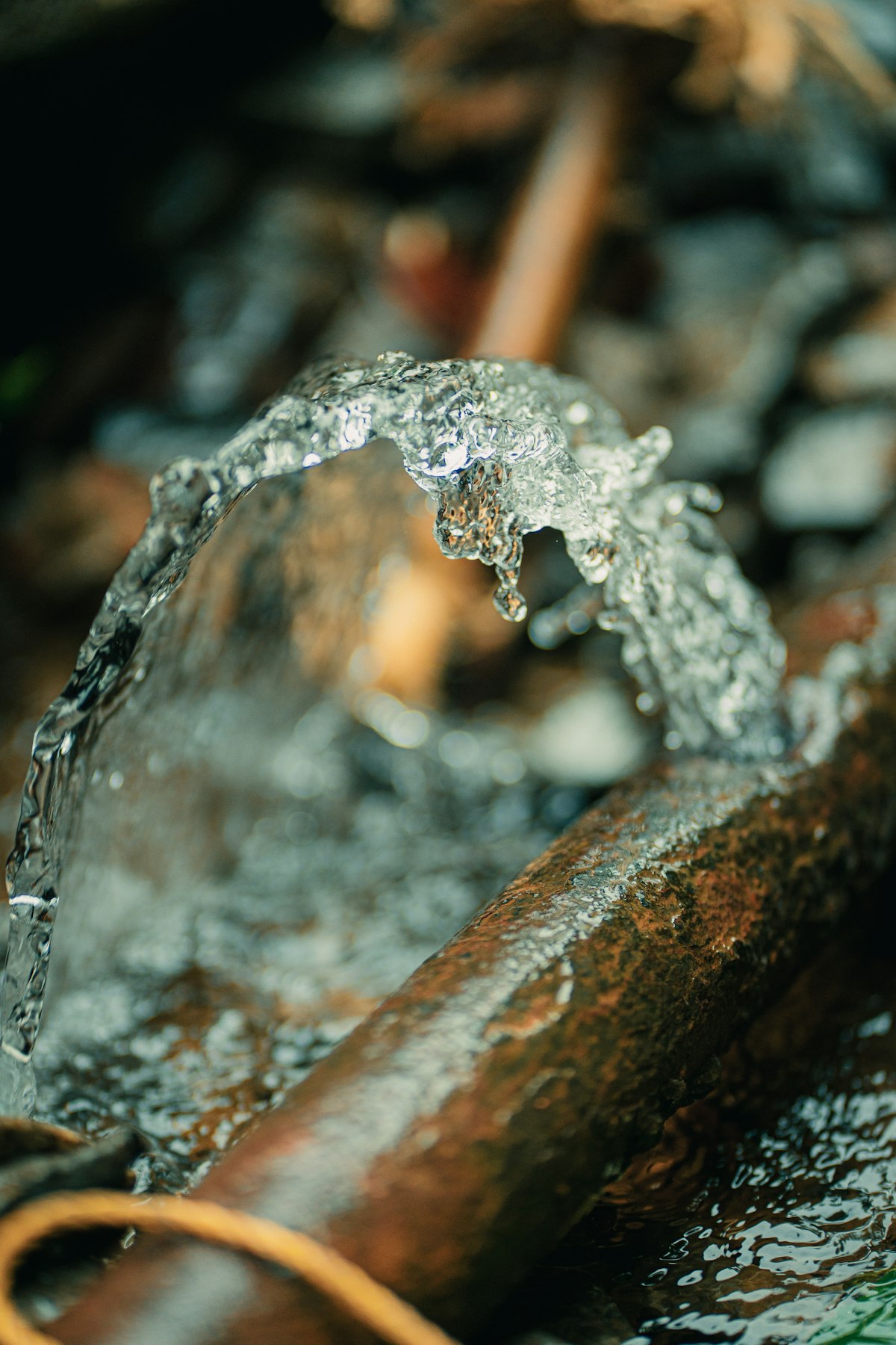 Water spraying from a failed pipe joint