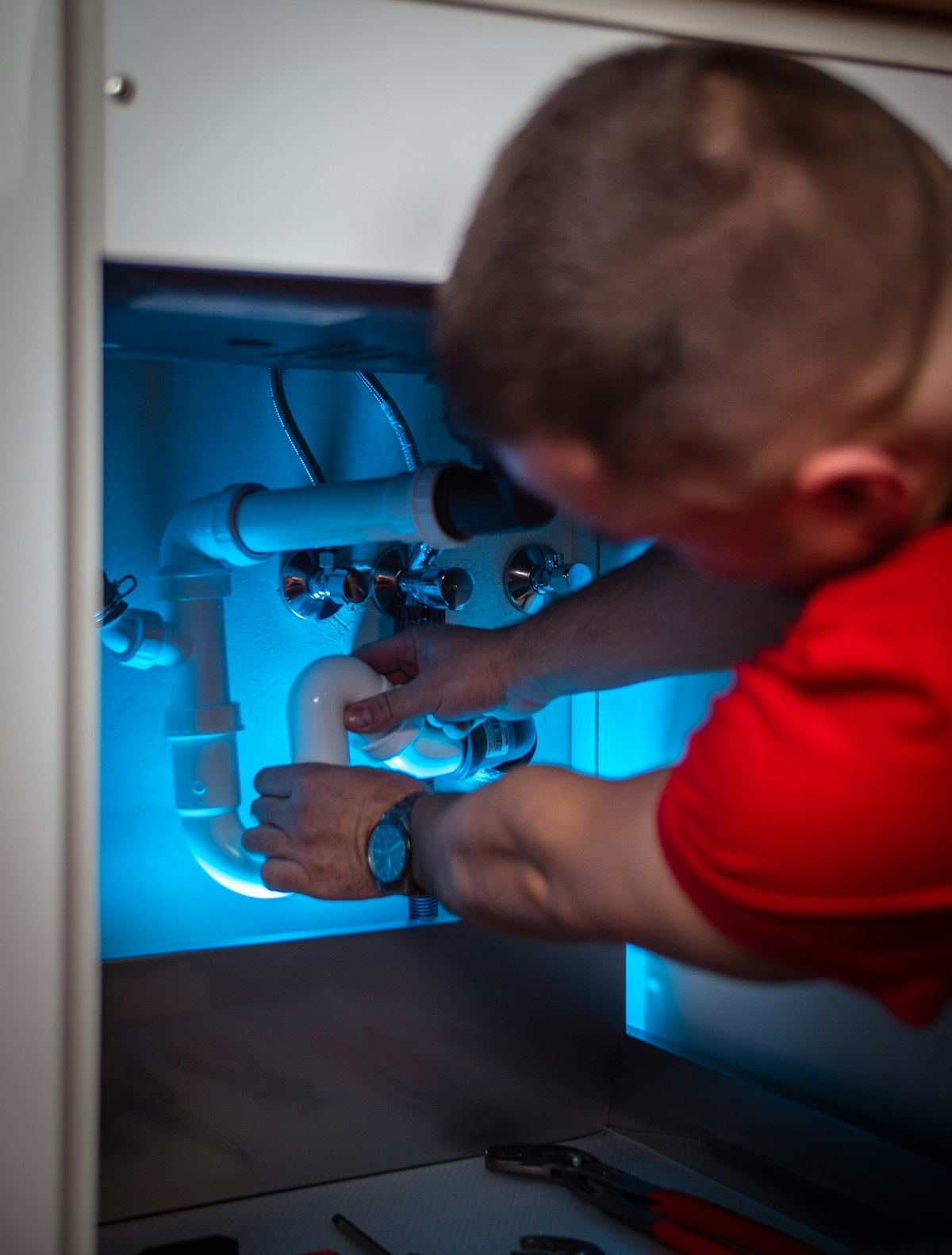 Plumber repairing a supply line